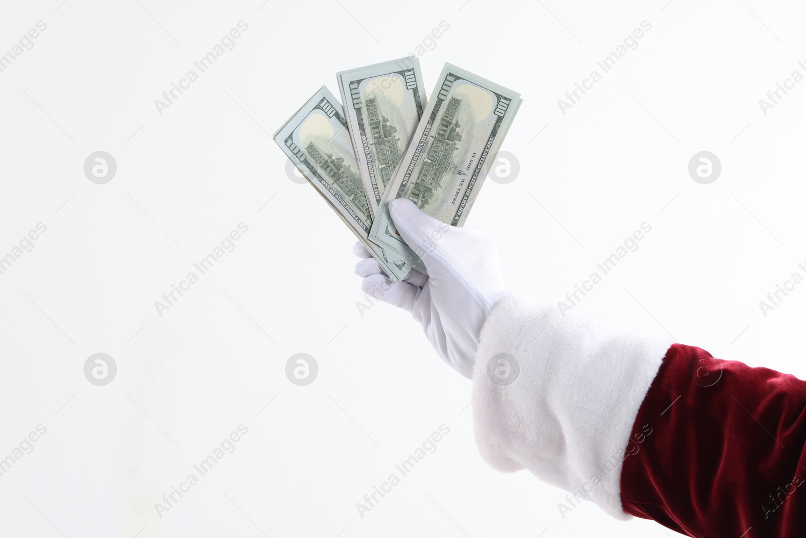 Photo of Santa Claus holding dollar banknotes on white background, closeup. Space for text