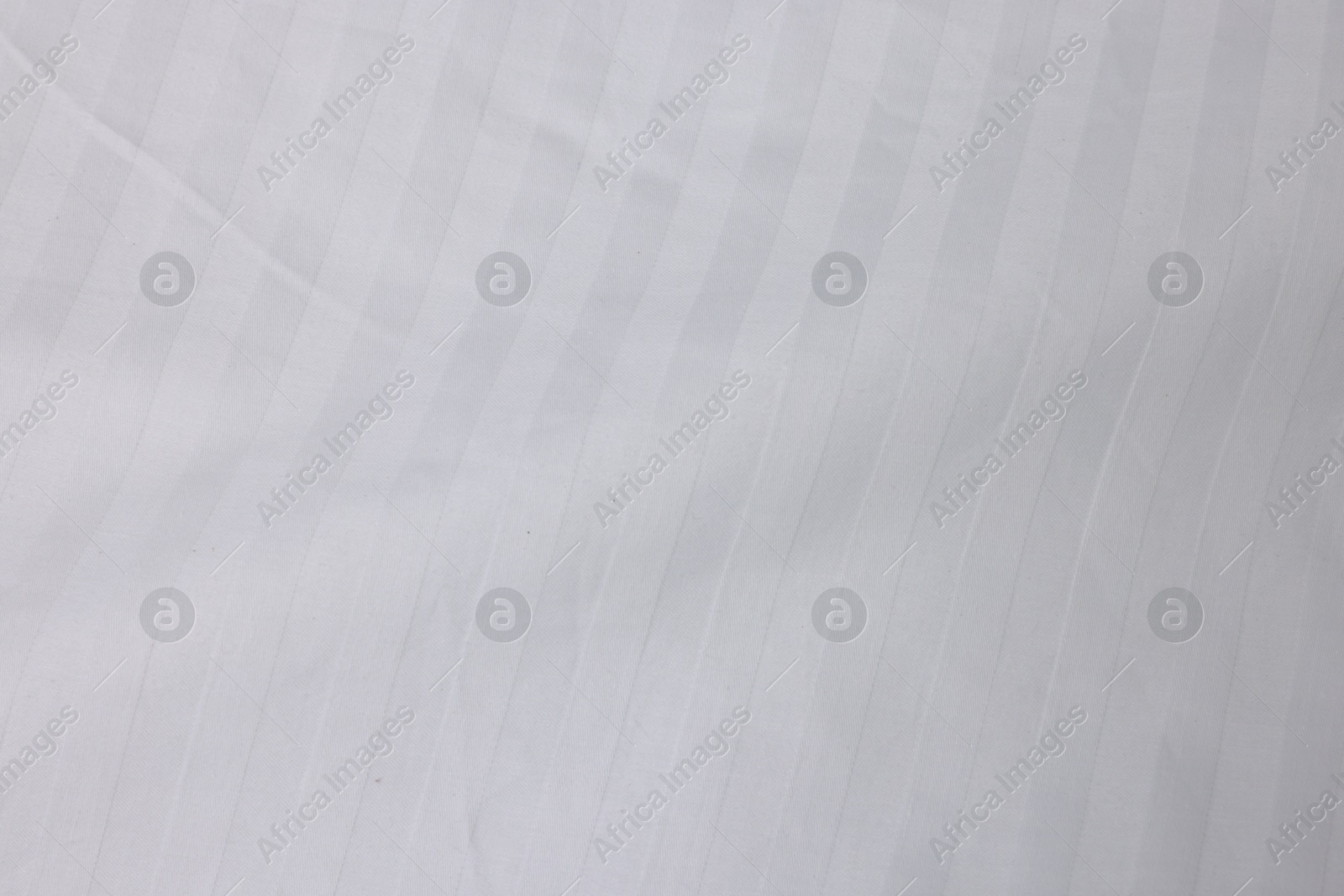 Photo of Clean white linens as background, top view