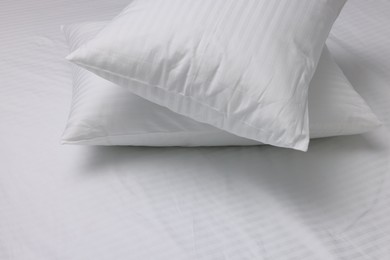 Photo of Bed with white clean linens and pillows