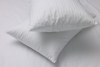 Photo of Bed with white clean linens and pillows