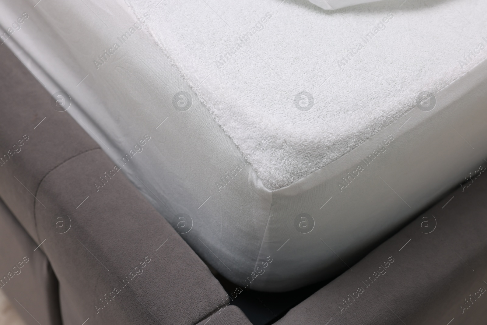 Photo of Bed with clean linens indoors, closeup view