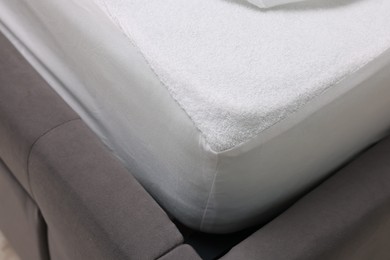 Bed with clean linens indoors, closeup view