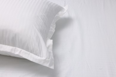 Photo of Bed with white clean linens and pillow, space for text