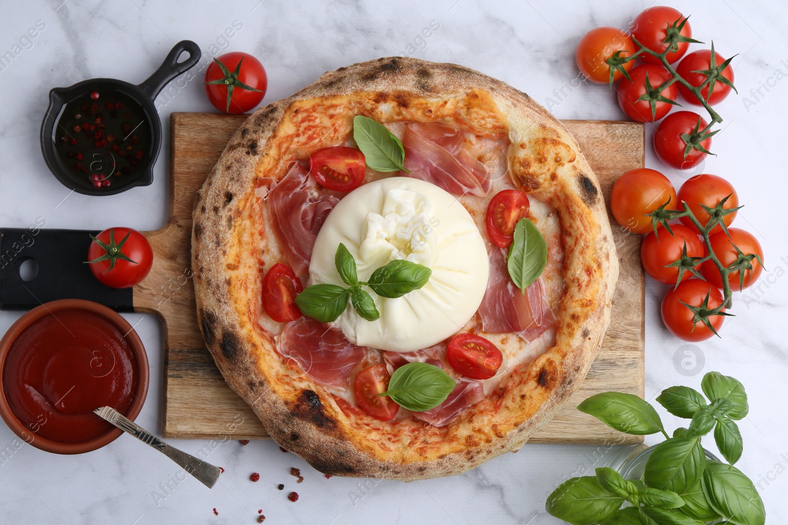 Photo of Delicious pizza with burrata cheese on white marble table, top view