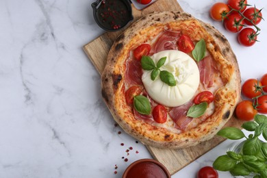 Photo of Delicious pizza with burrata cheese on white marble table, top view. Space for text