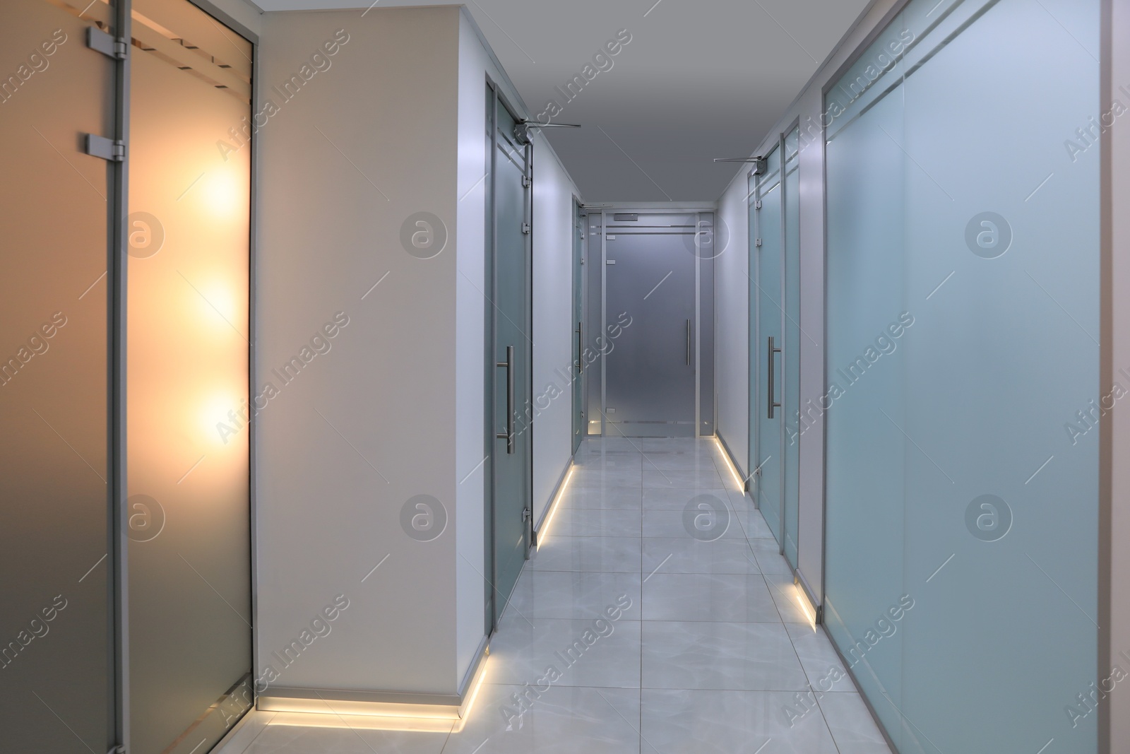 Photo of View of empty hospital corridor with doors