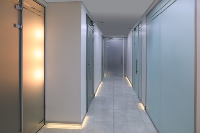 View of empty hospital corridor with doors