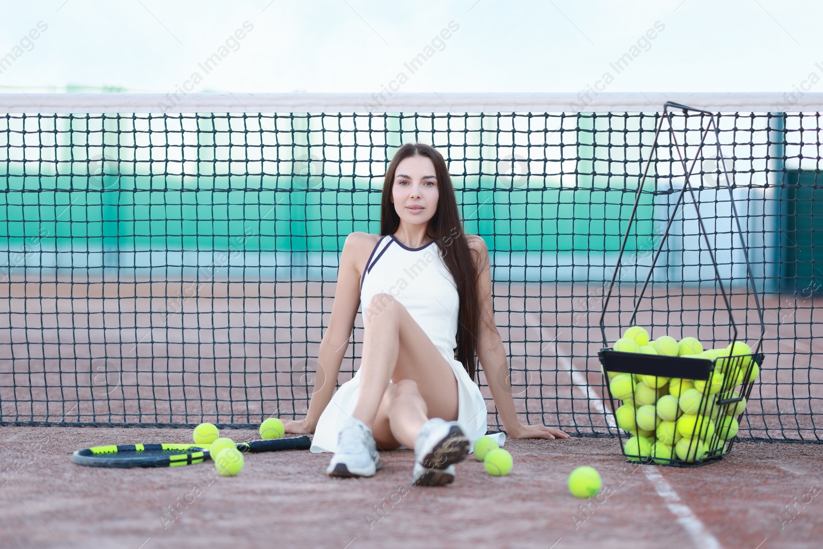 Photo of Beautiful woman in sportswear on tennis court