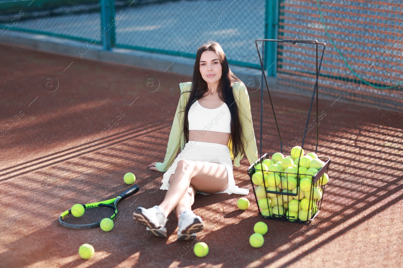 Photo of Beautiful woman in sportswear on tennis court