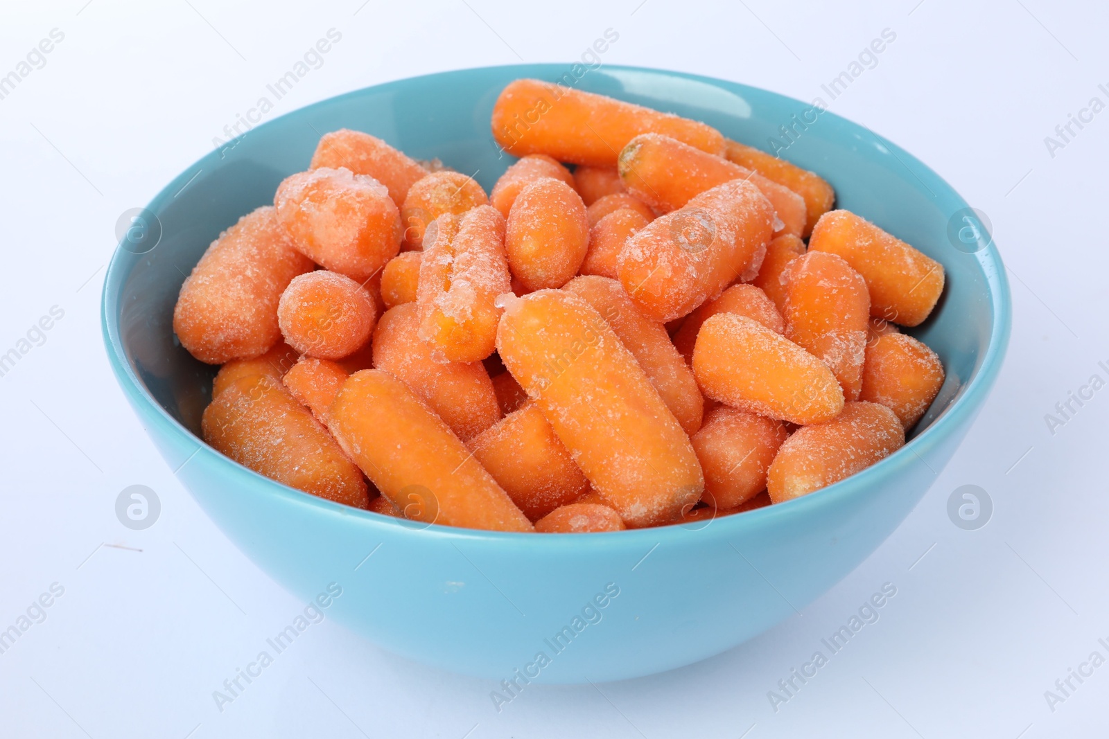 Photo of Frozen baby carrots in bowl isolated on white