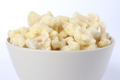 Photo of Frozen cauliflower in bowl isolated on white