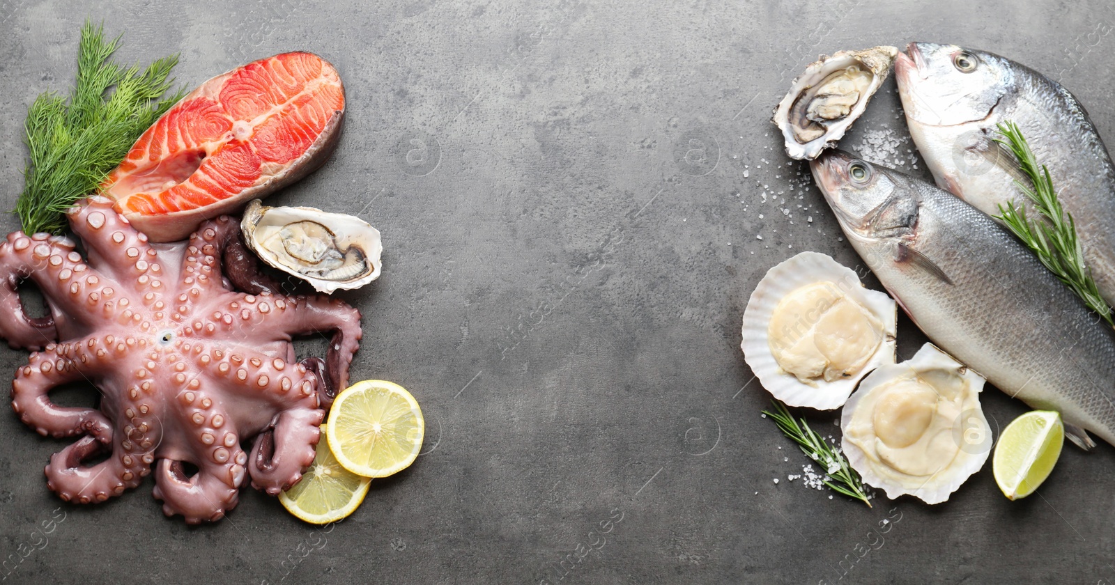 Photo of Different sea food on grey table, flat lay. Space for text