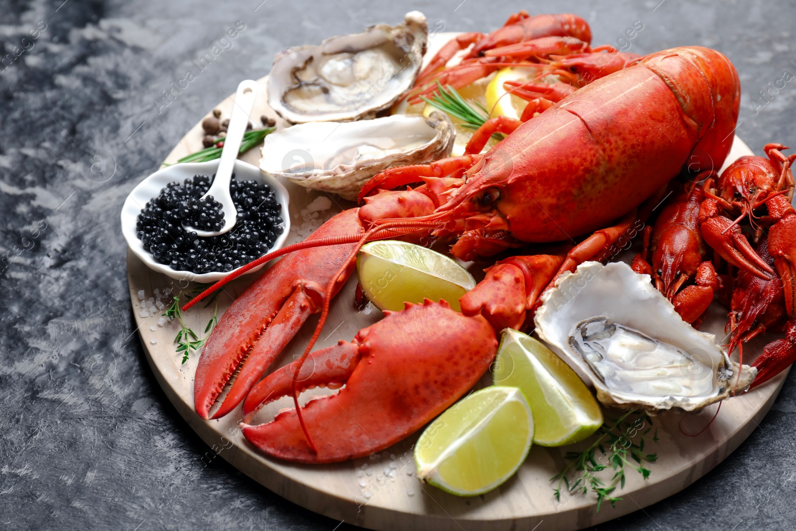 Photo of Many different sea food on dark table, closeup