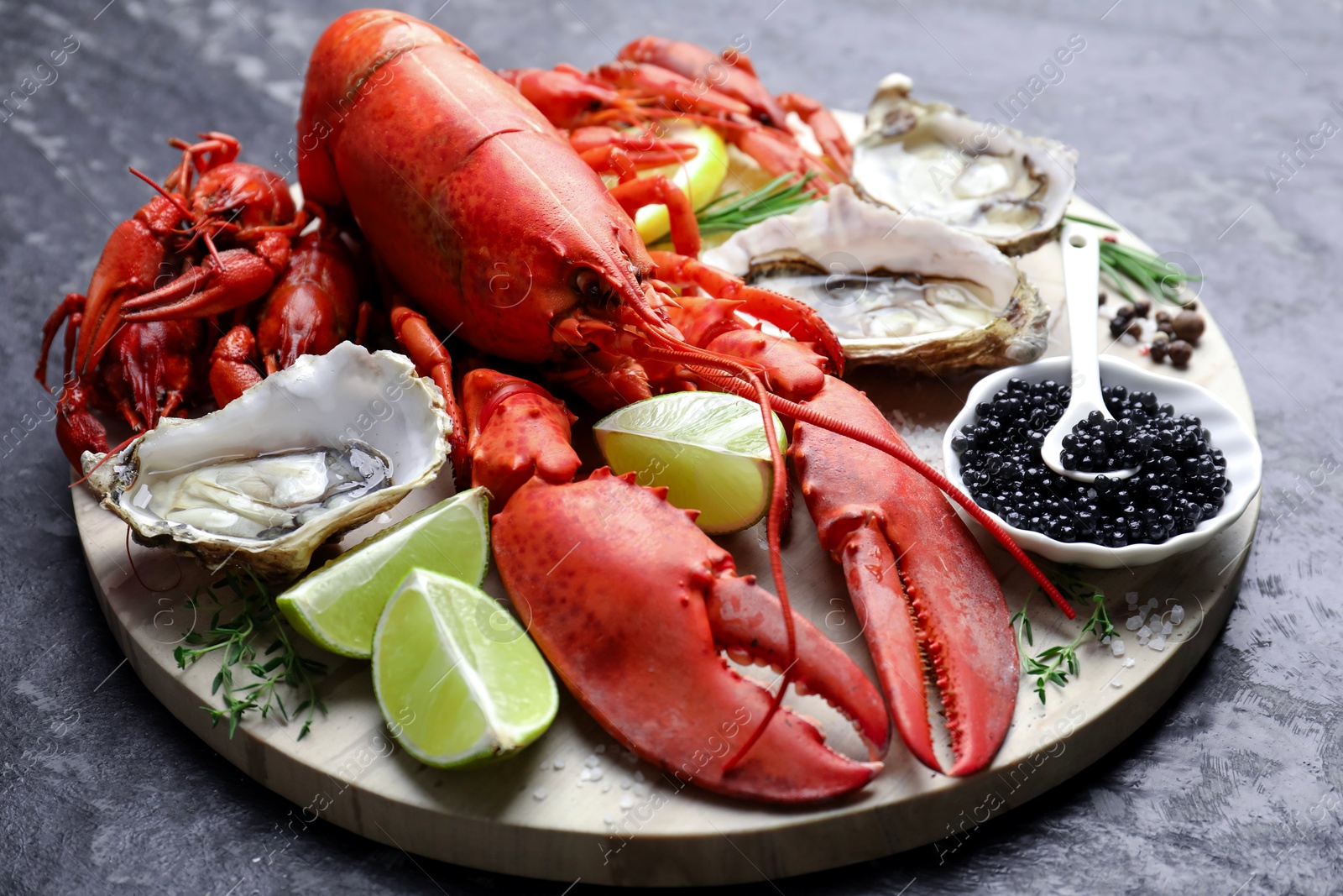 Photo of Many different sea food on dark table, closeup