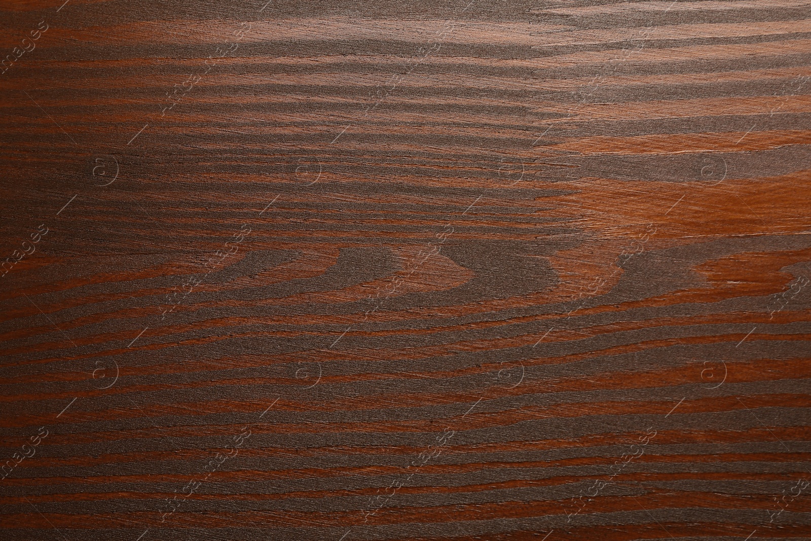 Photo of Texture of wooden surface after applying walnut wood stain as background, top view