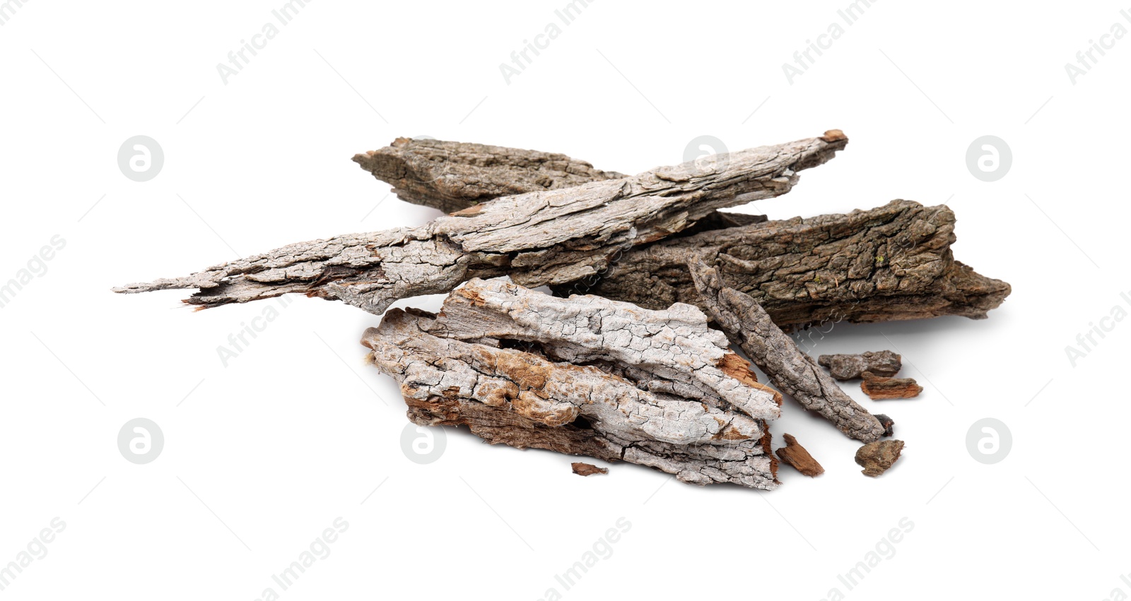 Photo of Heap of tree bark pieces isolated on white