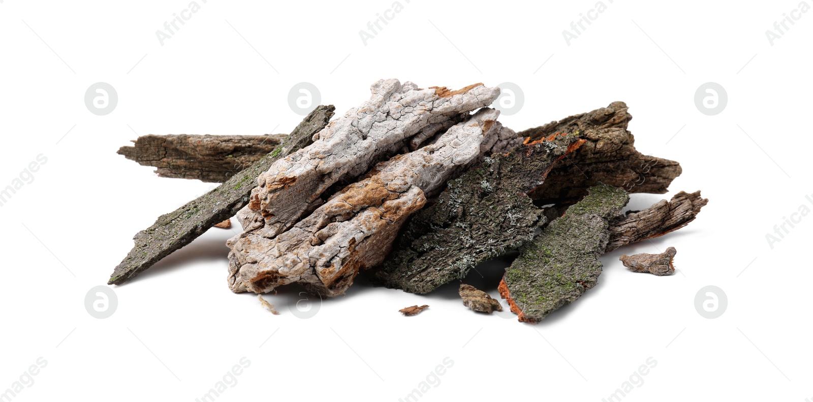 Photo of Heap of tree bark pieces isolated on white