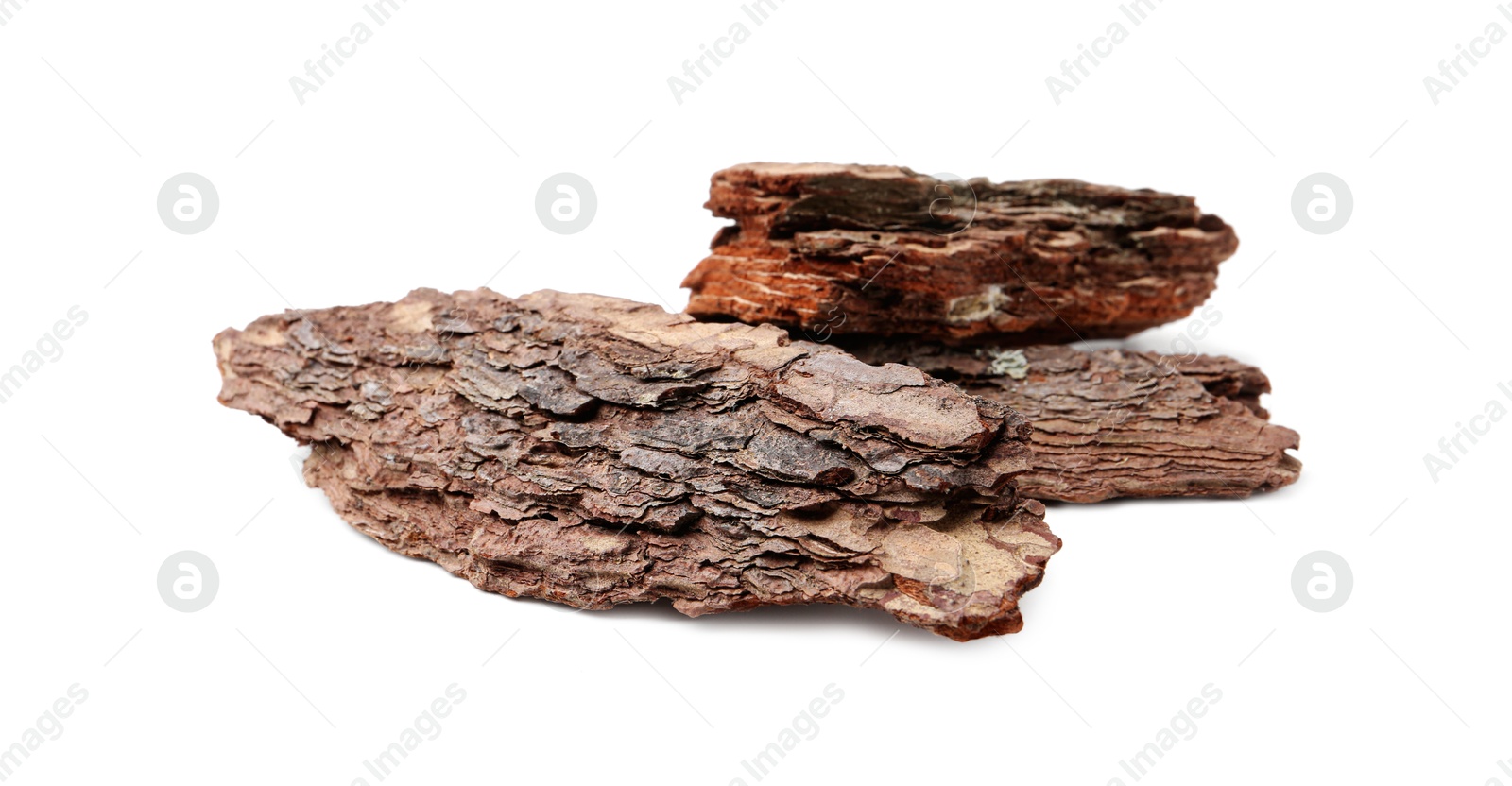 Photo of Pieces of tree bark on white background