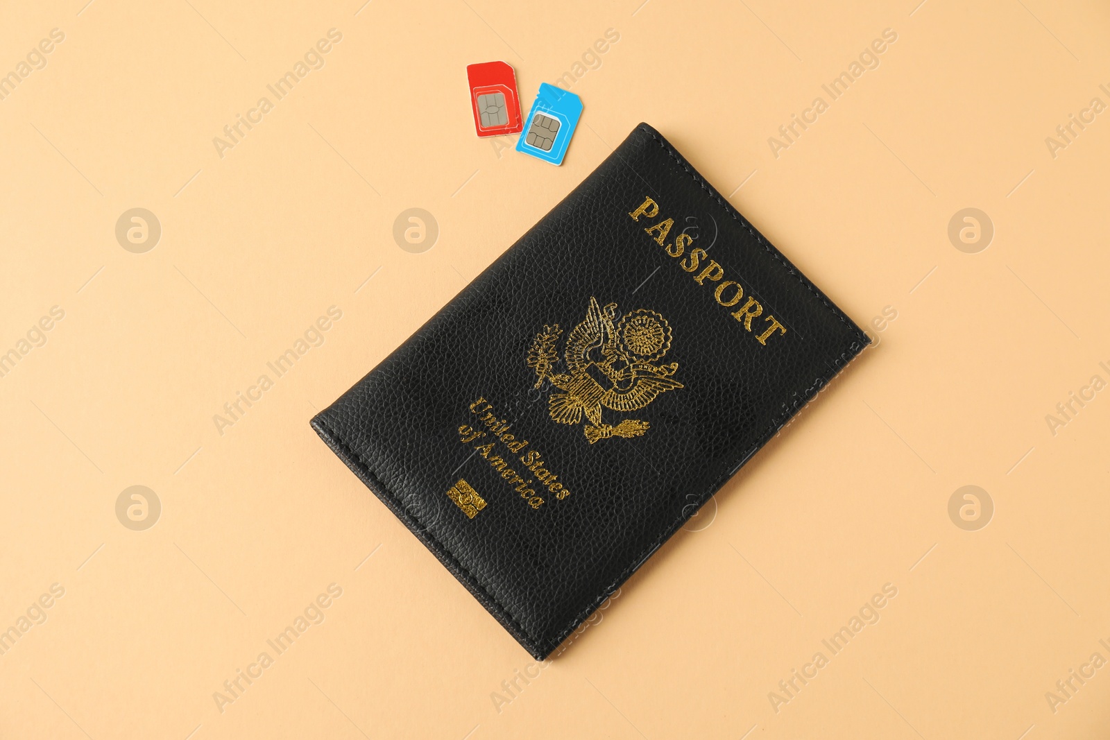 Photo of Modern SIM cards and passport on beige background, top view