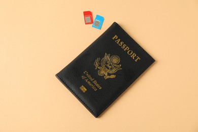 Modern SIM cards and passport on beige background, top view