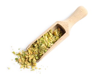 Photo of Pieces of peeled pistachio nut in wooden scoop isolated on white, top view