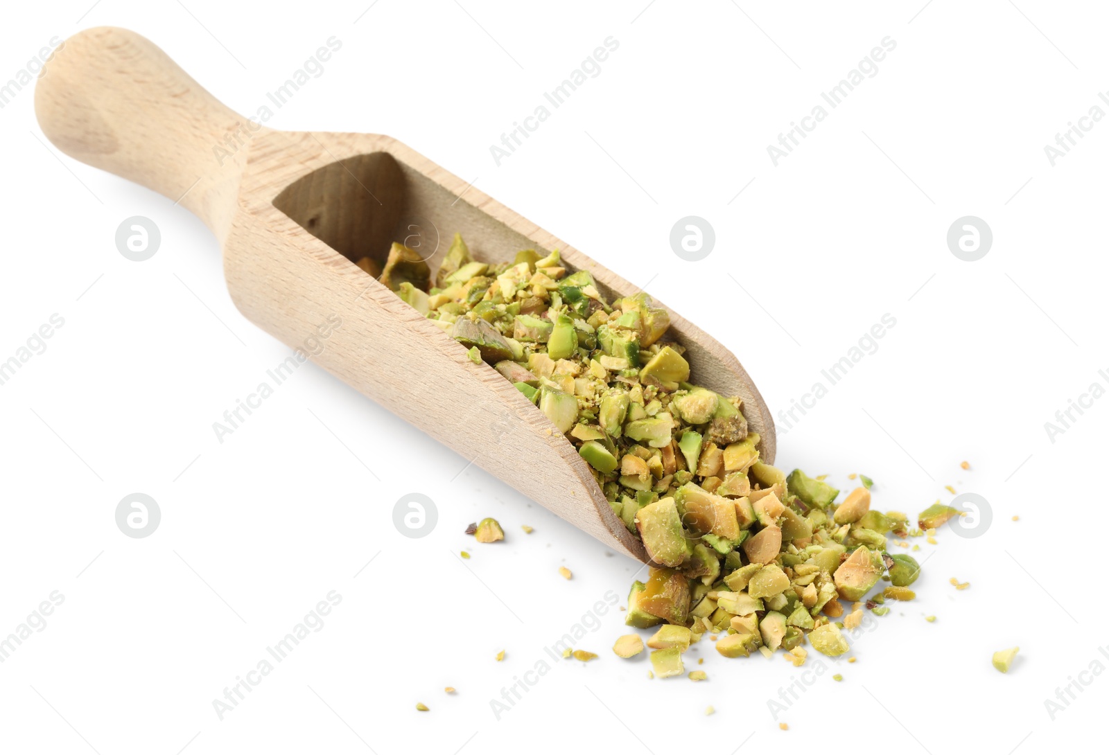 Photo of Pieces of peeled pistachio nut in wooden scoop isolated on white