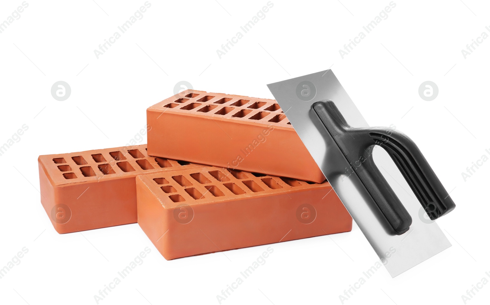 Photo of Red bricks and plastering trowel on white background