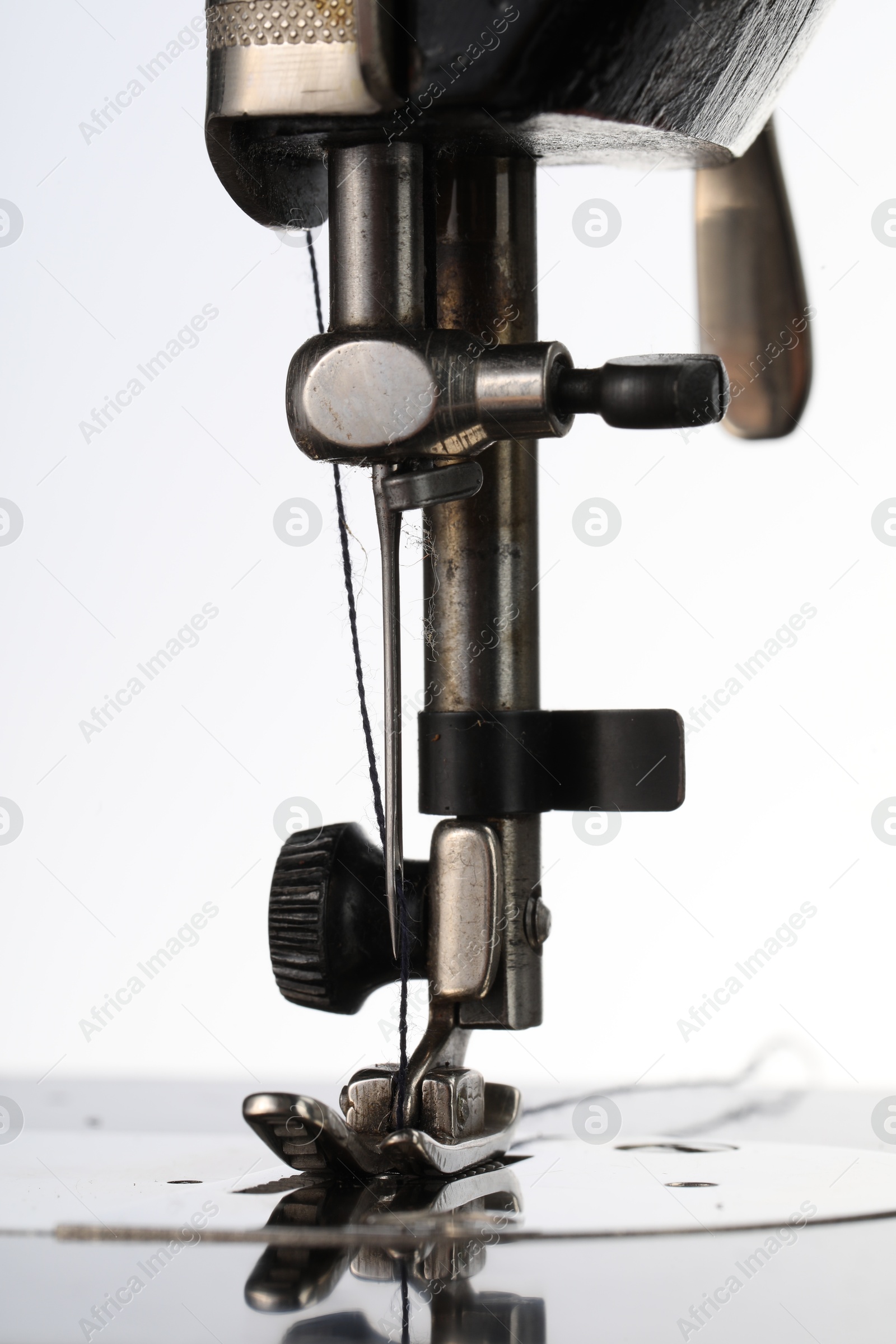 Photo of Sewing machine on white background, closeup view