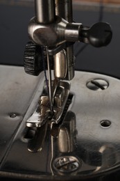 Photo of Sewing machine on grey background, closeup view