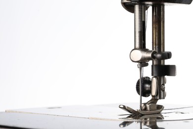 Photo of Sewing machine on white background, closeup view