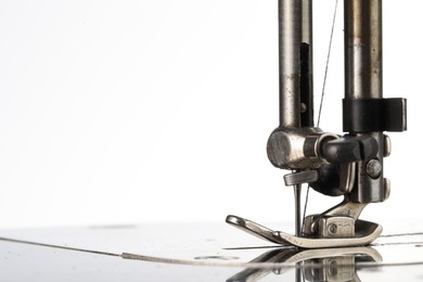 Photo of Sewing machine on white background, closeup view