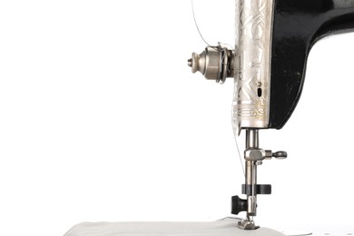 Photo of Sewing machine with grey fabric isolated on white