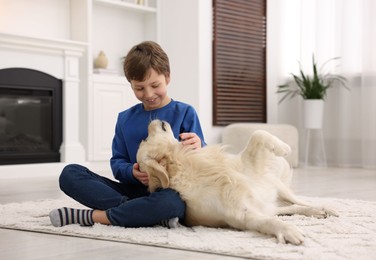 Boy with his cute dog at home