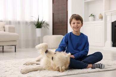 Boy with his cute dog at home