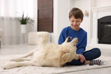 Boy with his cute dog at home