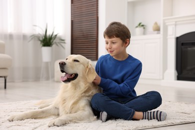 Boy with his cute dog at home