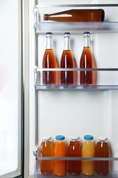 Photo of Many different cold drinks in refrigerator, closeup