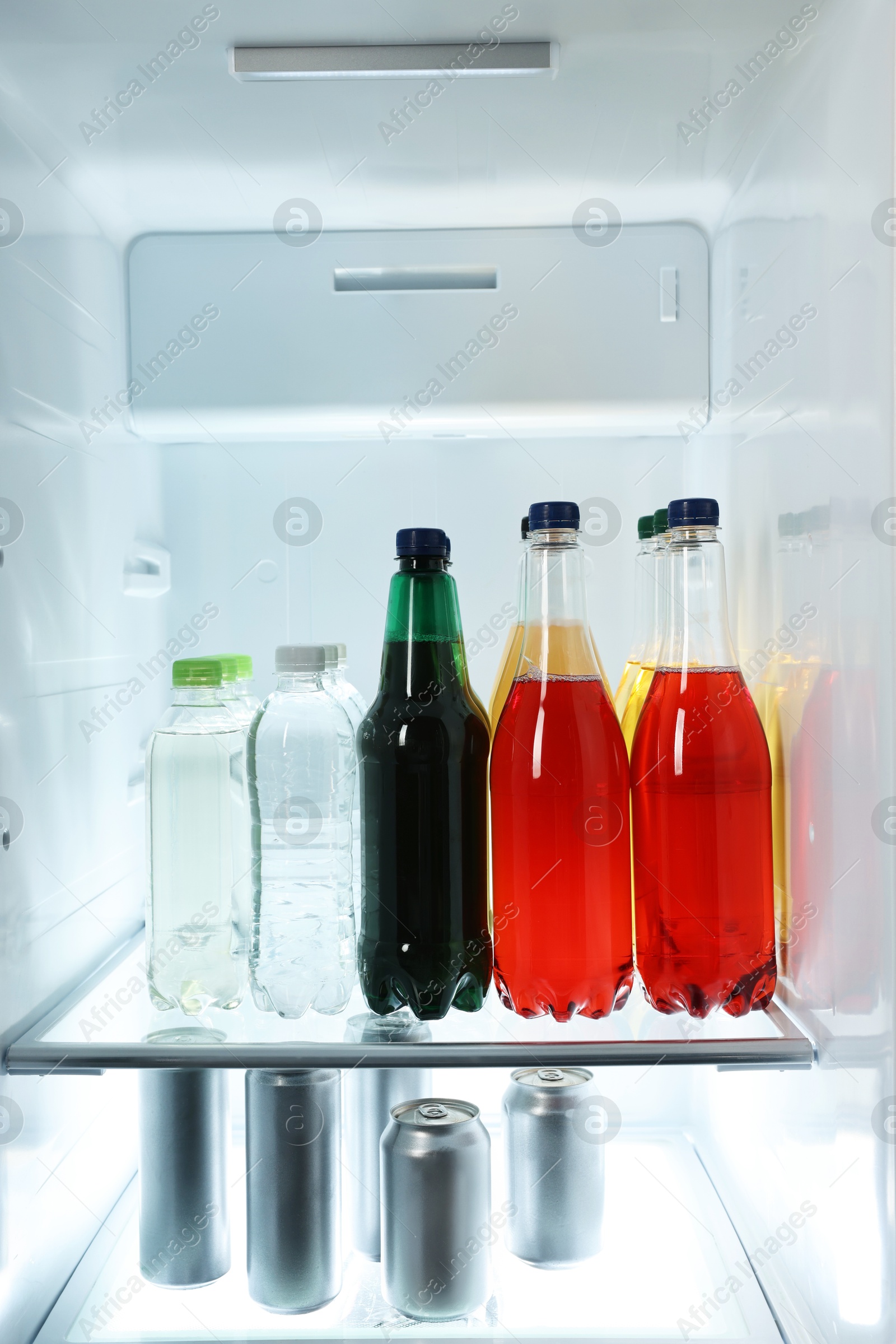 Photo of Many different cold drinks in refrigerator, closeup