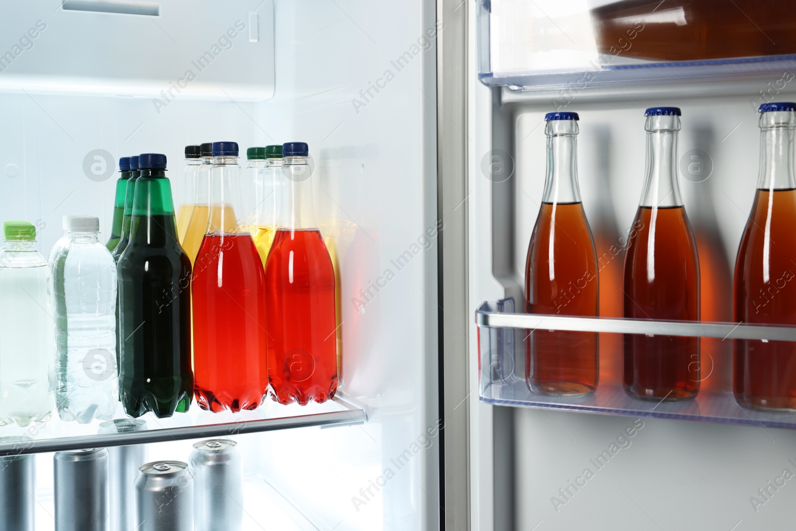 Photo of Many different cold drinks in refrigerator, closeup