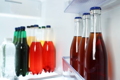 Photo of Many different cold drinks in refrigerator, closeup