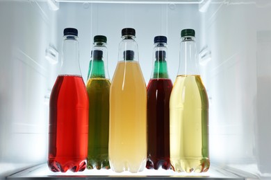 Photo of Many different cold drinks in refrigerator, closeup