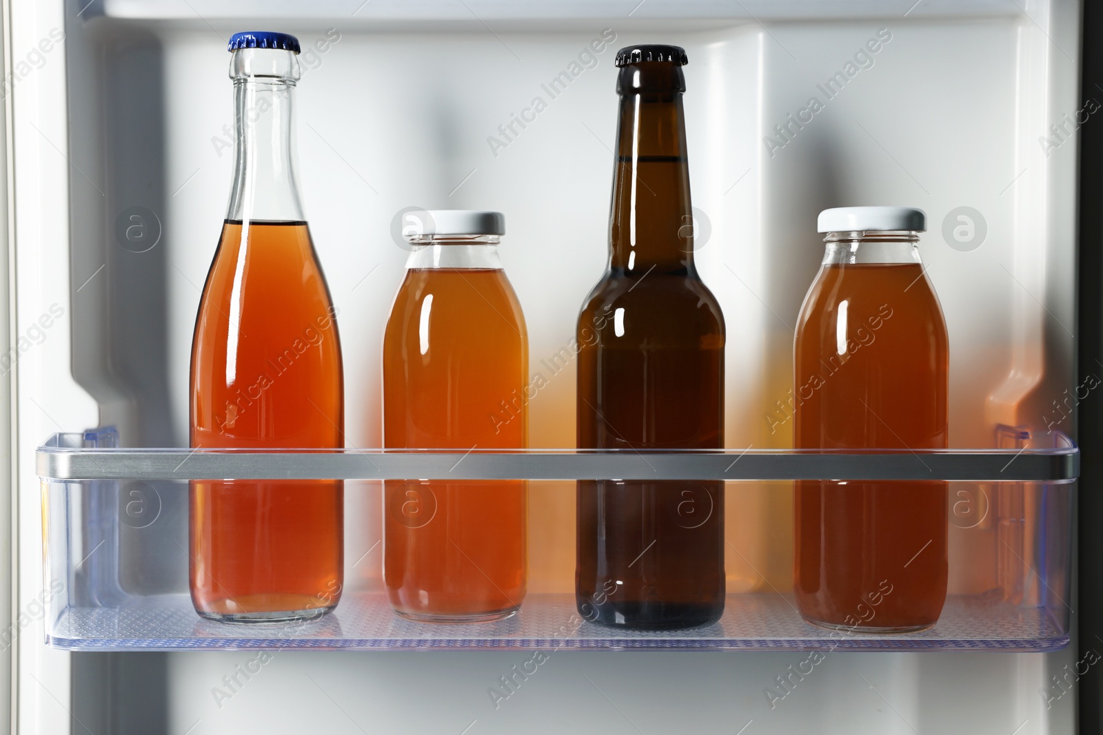 Photo of Many different cold drinks in refrigerator, closeup