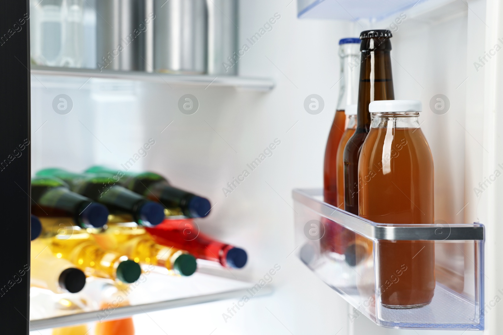 Photo of Many different cold drinks in refrigerator, closeup