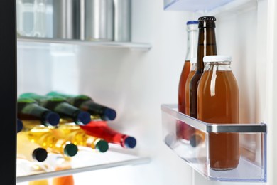 Photo of Many different cold drinks in refrigerator, closeup