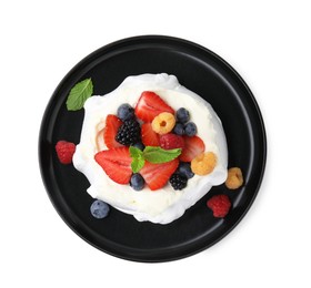 Pavlova cake (meringue dessert) with whipped cream, fresh berries and mint isolated on white, top view