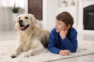 Photo of Boy with his cute dog at home