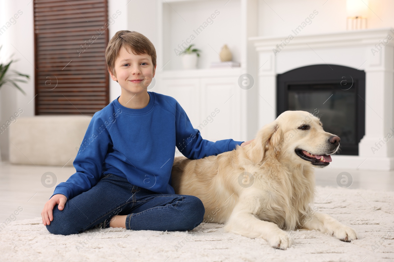 Photo of Boy with his cute dog at home