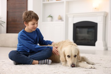 Boy with his cute dog at home