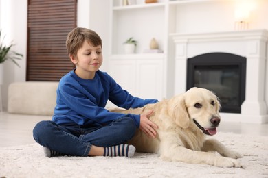 Boy with his cute dog at home