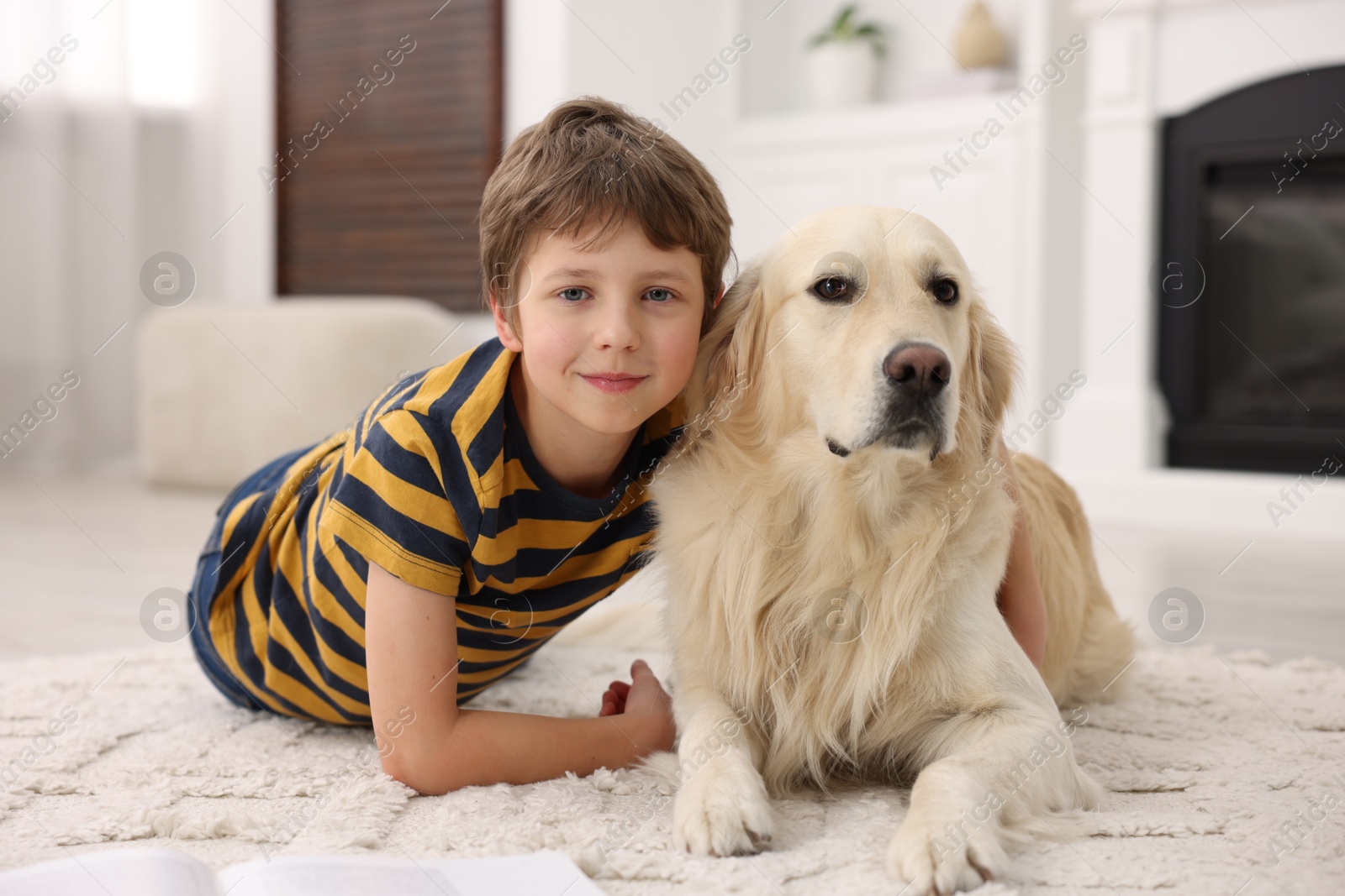 Photo of Boy with his cute dog at home